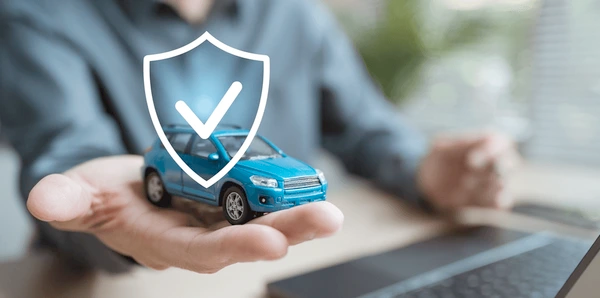 A driver sitting confidently in a car with a digital policy shield, representing secure insurance